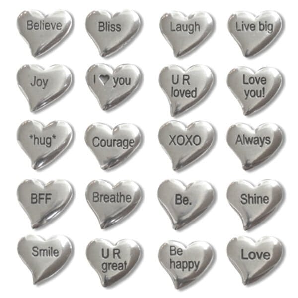 The Pouch of Tiny Hearts includes 20 silver, heart shaped pocket charms, each with an engraved positive or loving message such as "Believe," "Laugh," "I ♥ you," "Courage," and more.