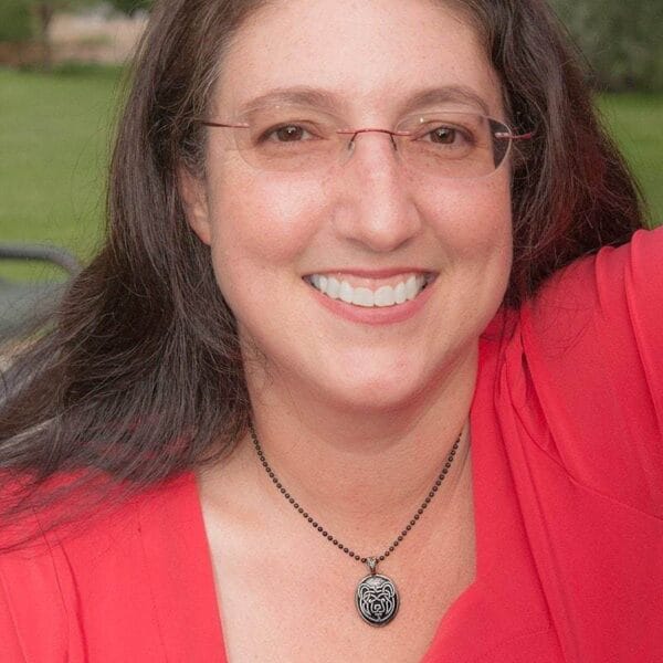 A woman wearing a red shirt.