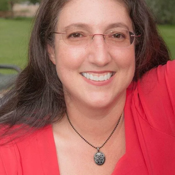 A woman wearing a red shirt.