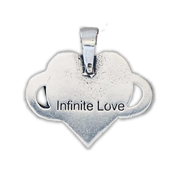 A heart shaped pendant with the word infinite love on it.