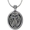 A pendant with an owl on it.