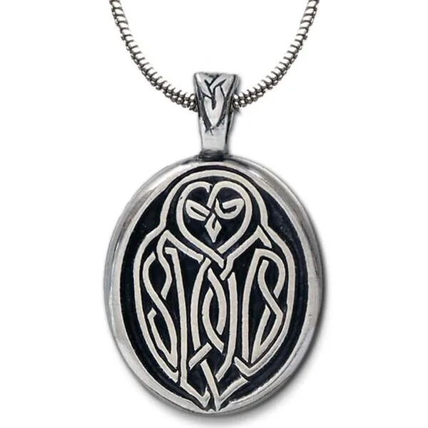 A pendant with an owl on it.