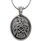 A pendant with a celtic eagle on it.