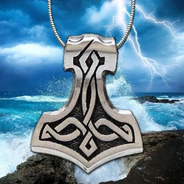 A thor hammer pendant with a lightning bolt on it.