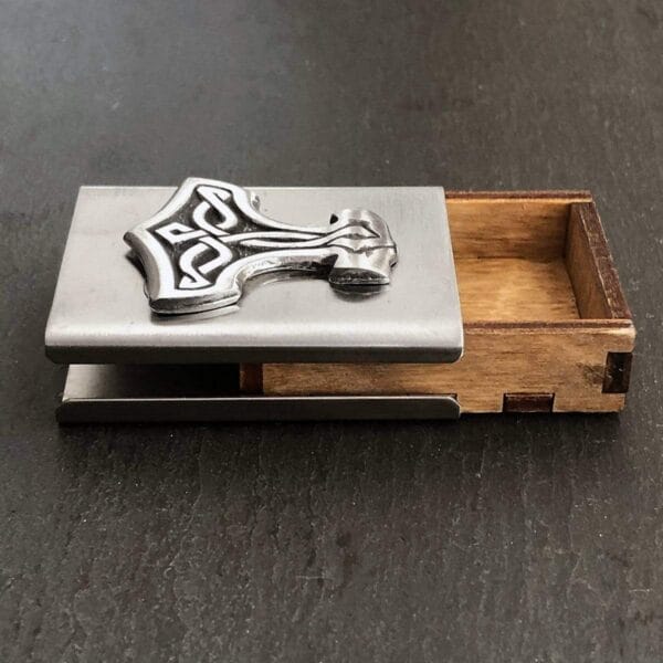 A business card holder with a cross on it.