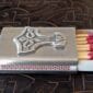 A matchbox with a thor hammer on it.
