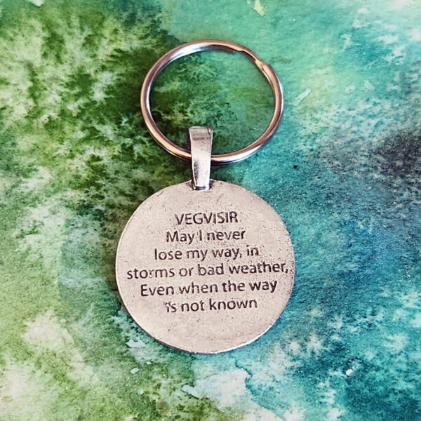 A Viking Wayfinder Keychain with a quote on it that reads, i love my weather.