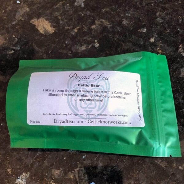 A green packet of tea sitting on a counter.