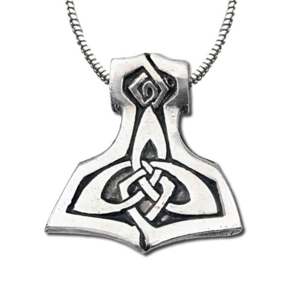 A pendant with a celtic hammer on it.
