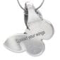 A silver butterfly pendant with the words spread your wings.
