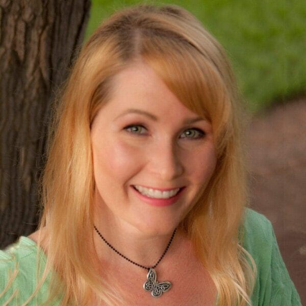 A woman wearing a green shirt.