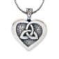 A heart shaped pendant with a celtic knot on it.