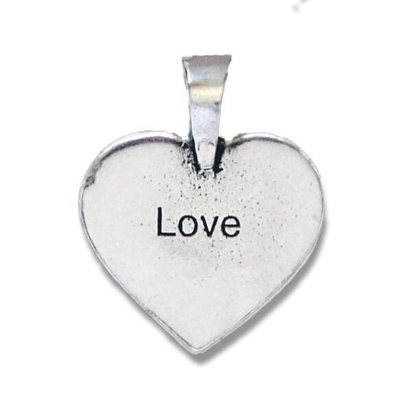 A heart shaped pendant with the word love on it.
