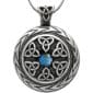 A silver celtic pendant with a blue stone.