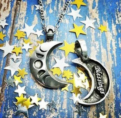 A necklace with a crescent moon and stars on it.