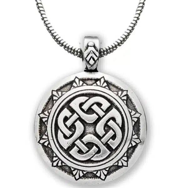 A celtic knot pendant on a silver chain. A celtic knot pendant on a silver chain.