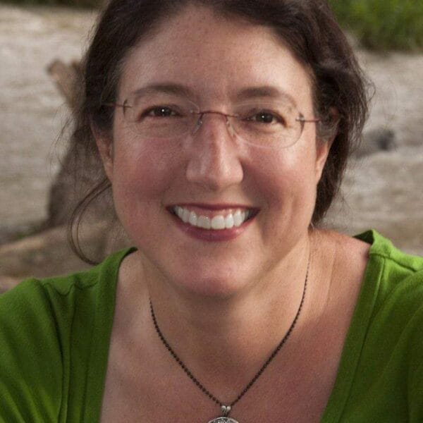 A woman wearing a green shirt.