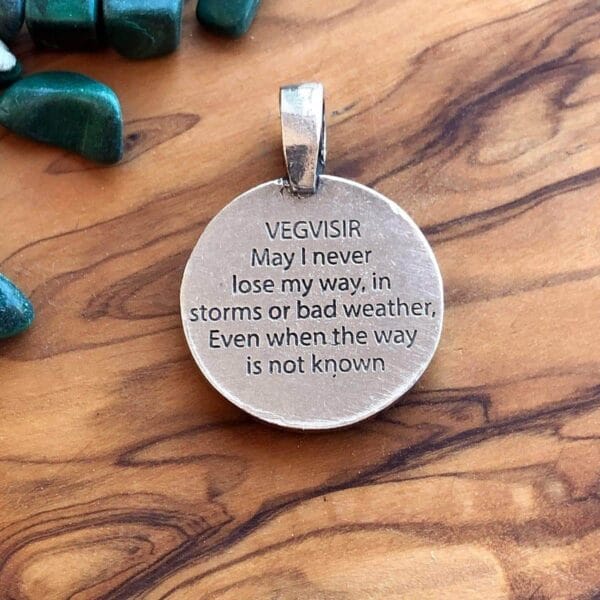 A round pendant with a quote that says, i may never be in storms or bad weather.
