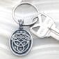 A key chain with a celtic design on it.