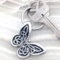 A keychain with a celtic design on it.