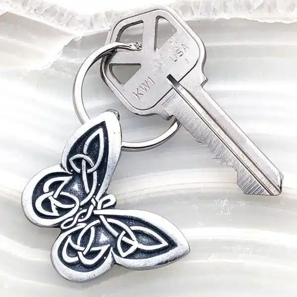 A key chain with a butterfly on it. A key chain with a butterfly on it.