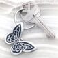 A key chain with a butterfly on it.