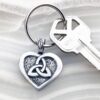 A heart shaped key chain with a celtic knot on it.