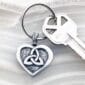 A heart shaped key chain with a celtic knot on it.