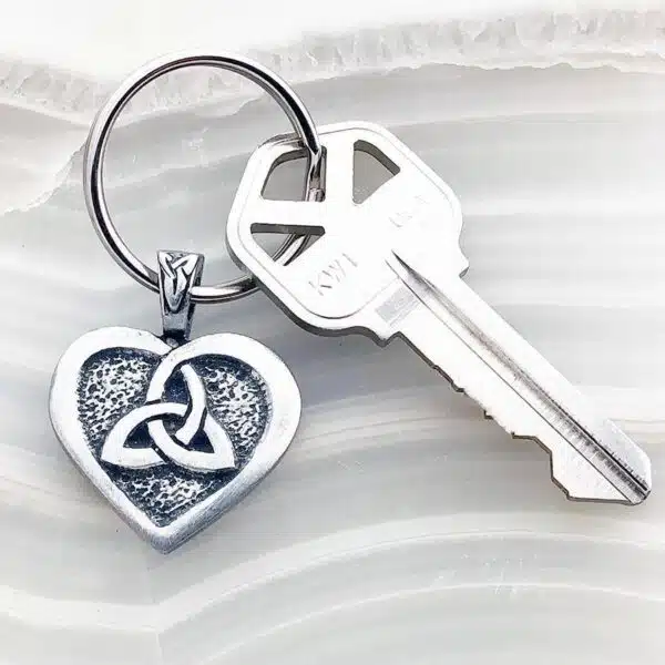 A keychain with a celtic heart on it.