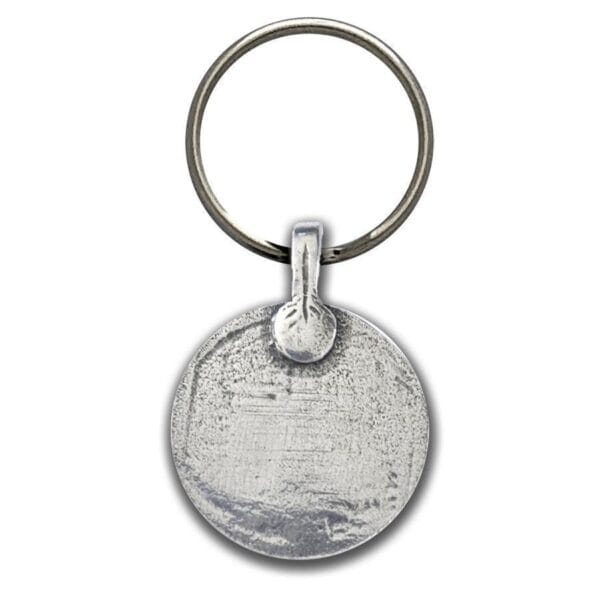 A silver key ring with a circle on it.