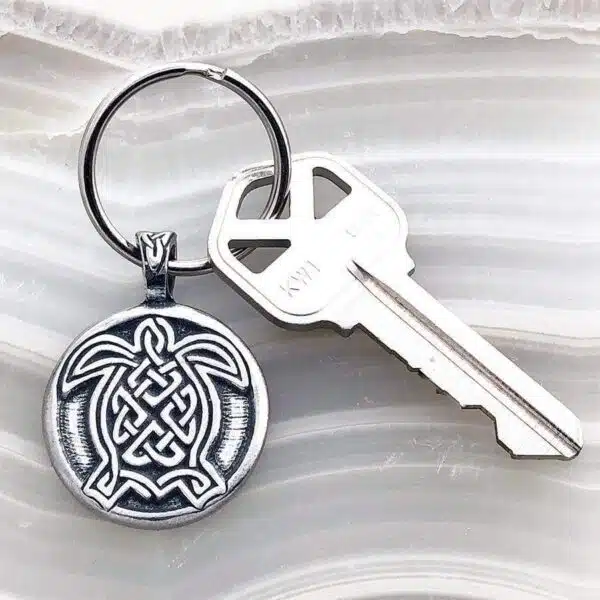 A keychain with a celtic design on it. A keychain with a celtic design on it.