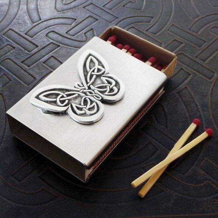 A matchbox with a butterfly on it. A matchbox with a butterfly on it.