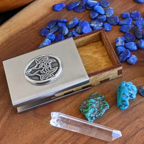 A business card holder with stones and crystals.