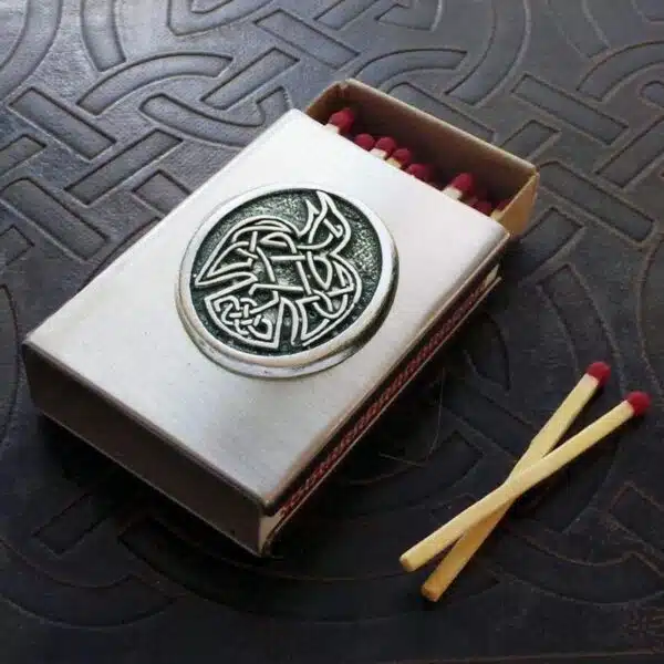 A matchbox with a celtic design on it.