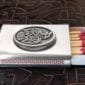 A matchbox with a celtic design on it.