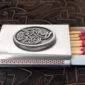 A matchbox with a celtic design on it.