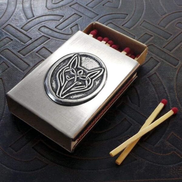 A matchbox with a wolf emblem on it. A matchbox with a wolf emblem on it.