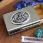A business card holder with crystals and a fox on it.