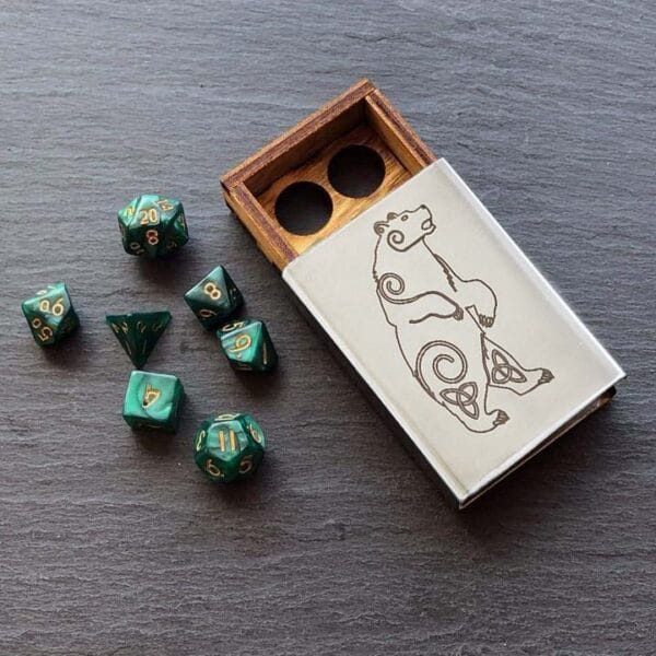 A set of green dice and a wooden box.