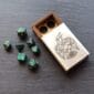 A set of dice in a wooden box.