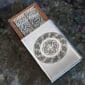 A metal box with a celtic design on it.