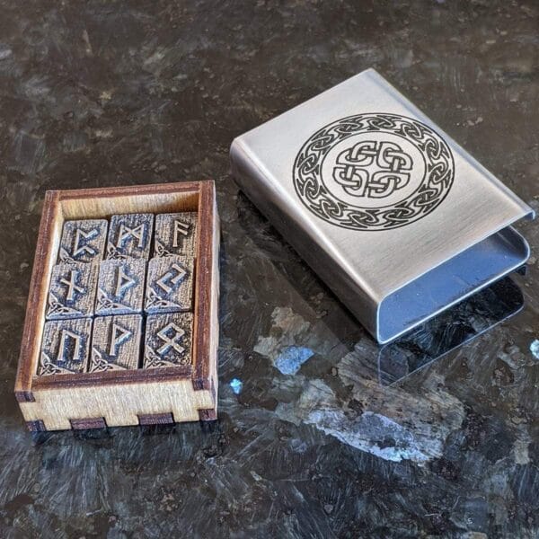 A wooden box with a viking symbol on it.