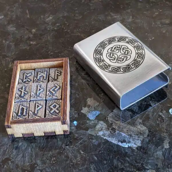 A wooden box with a viking symbol on it.