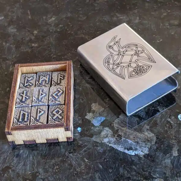 A wooden box with viking symbols on it.