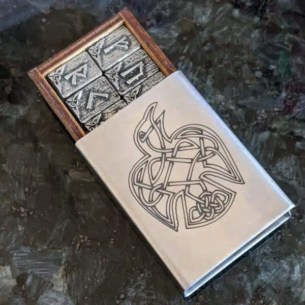 A metal box with a celtic design on it. A metal box with a celtic design on it.