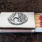 A matchbox with a celtic design on it.