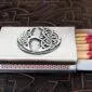 A matchbox with a celtic design on it.