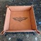 A brown tray with a bat design on it.