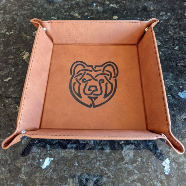 A brown tray with a bear logo on it.