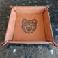 A brown tray with a bear logo on it.